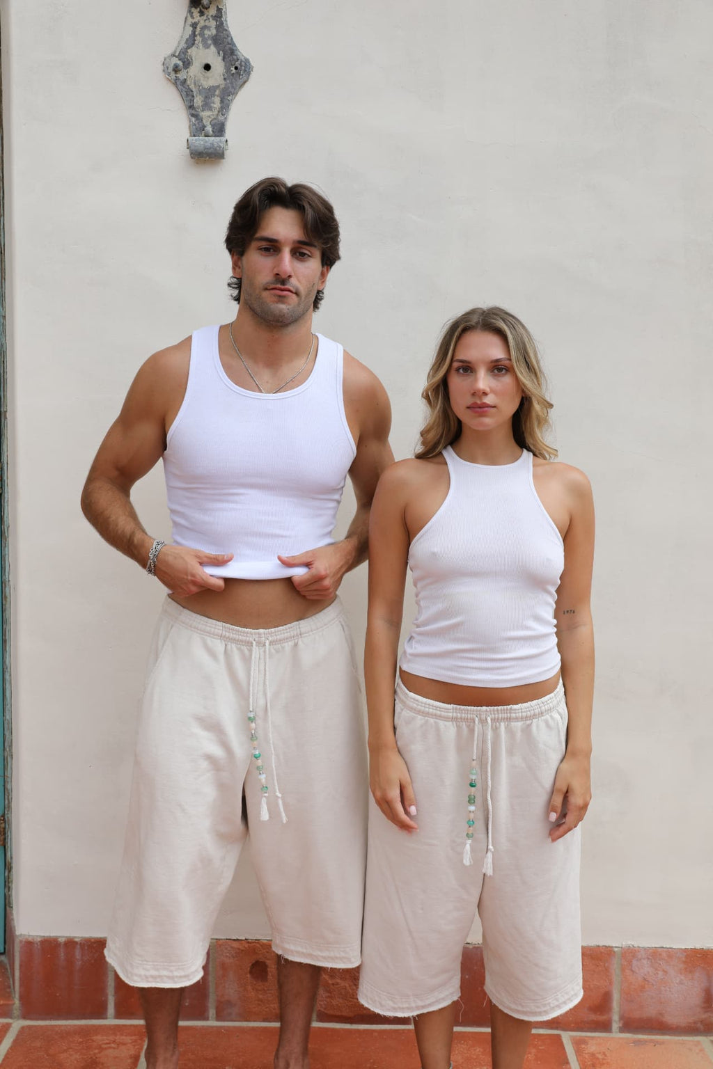 BELDI Ivory shorts · couple facing camera
