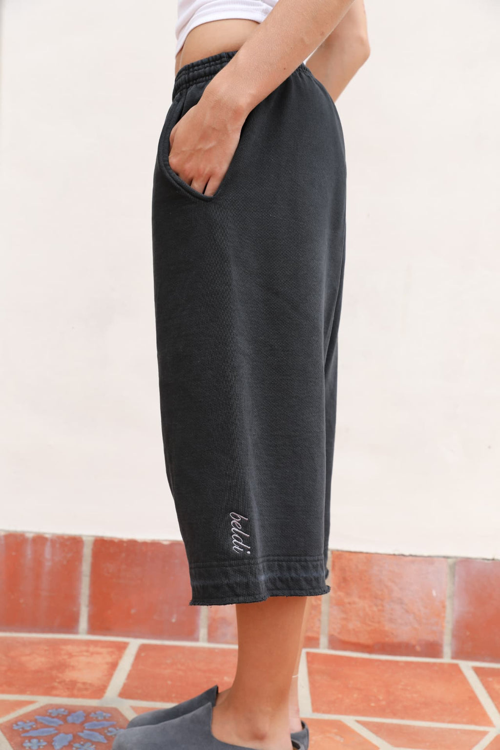 BELDI Onyx shorts · side profile with beldi. embroidery