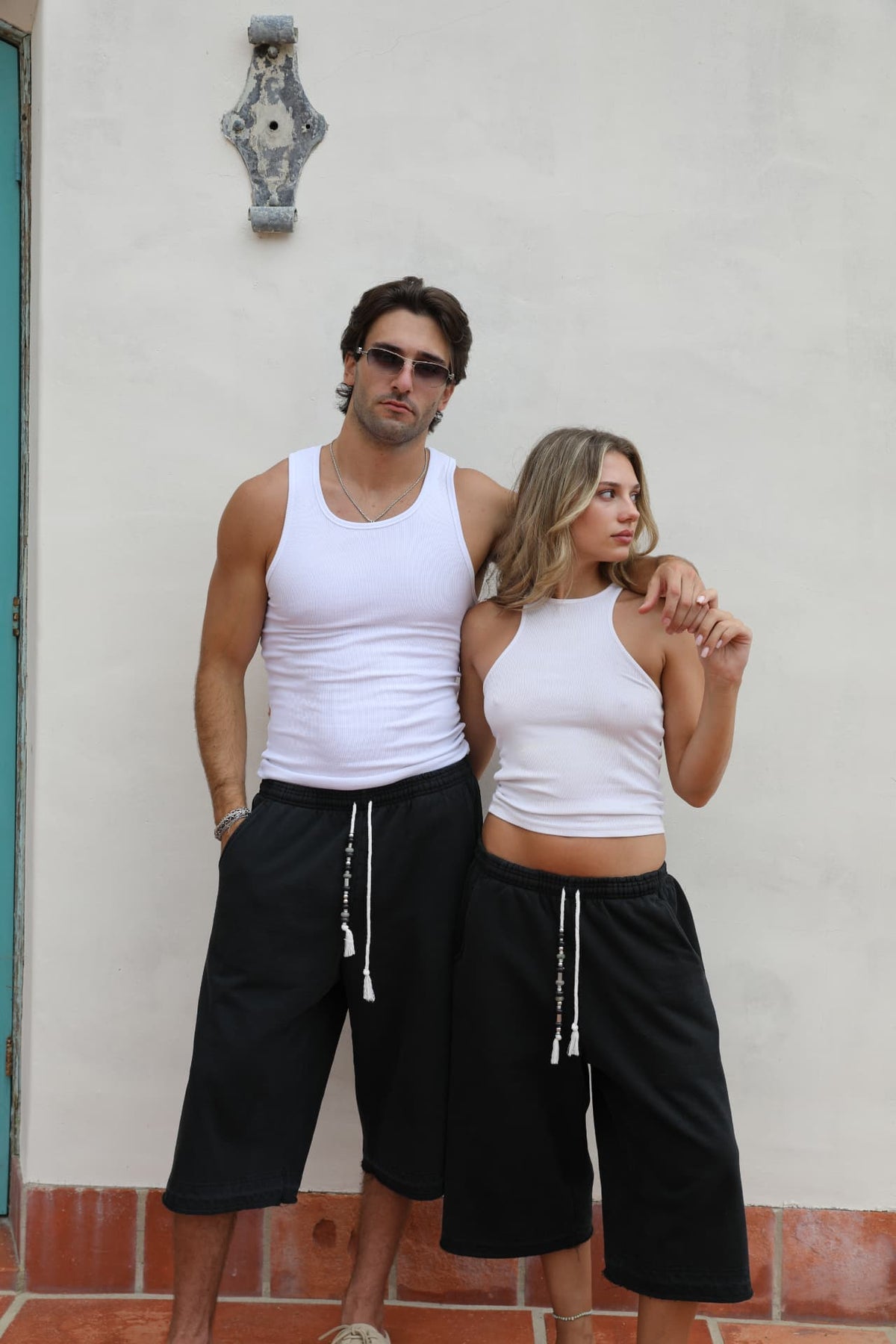 BELDI Onyx shorts · couple facing camera